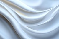 Elegant white silk fabric with soft flowing waves and gentle folds creates luxurious texture against light background, suitable for wedding and fashion designs.