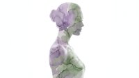 Young woman profile silhouette filled with delicate purple watercolor flowers and green leaves on white background for wellness and beauty concepts.