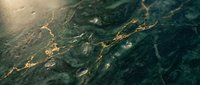 Luxurious dark green marble surface with golden veins and natural stone texture for elegant interior design and architectural applications.
