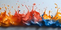 Dynamic liquid splashes in orange, red and blue colors creating energetic motion effect against light background. Colorful paint drops collide and merge.