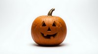 Carved orange pumpkin jack-o-lantern with smiling face isolated on white background for Halloween decorations and autumn seasonal designs.