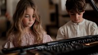 Two young children playing piano together in music lesson, blonde girl and brunette boy learning keyboard skills in home setting for education content.