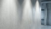 Modern concrete wall interior with dramatic lighting and architectural details creating contemporary minimalist space for commercial design projects.