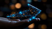Glowing blue arrow made of particles and light trails floating above an open hand against dark blurred background, representing growth, success, and digital transformation for business concepts.