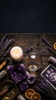 Mystical witchcraft altar with amethyst crystals, burning candle, tarot cards, dried lavender and sage bundles on rustic wooden table for spiritual rituals.