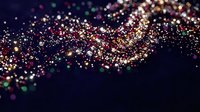 Abstract colorful glitter particles flowing in wave pattern on dark background. Sparkling bokeh lights create magical atmosphere for luxury designs.