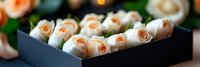 Fresh white roses with peach centers arranged in elegant black gift box for romantic occasions, weddings, anniversaries and special celebrations.