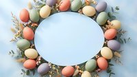 Easter egg wreath frame with pastel colored eggs, dried flowers and eucalyptus branches on light blue background for spring holiday greeting cards.