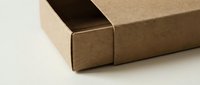 Brown cardboard shipping box with open flap on neutral background for packaging and delivery concepts in e-commerce and logistics business.