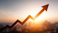 Rising arrow chart against sunset sky showing business growth and financial success with upward trending line and warm golden light.