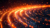 Glowing orange and blue particles form dynamic curved lines against dark background, creating abstract cosmic motion effect with bokeh light trails.