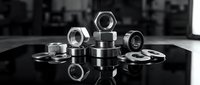 Metal nuts and bolts scattered on reflective black surface in monochrome industrial workshop setting for mechanical engineering and construction projects.