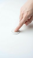 Caucasian hand pressing white circular button on clean surface, isolated on white background for UI design, app interface, and technology mockup projects.