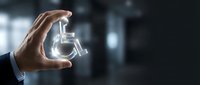 Businessman hand holding glowing water tap icon symbol, representing sustainable resource management and eco-friendly utility services for corporate presentations.