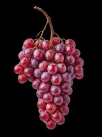 Fresh red grape bunch isolated on transparent background, ready for t-shirt design, stickers, clipart, print on demand, sublimation, and food packaging projects.
