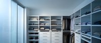 Modern walk-in closet with organized shelving, hanging rods, and drawers in contemporary bedroom interior design for luxury home storage solutions.