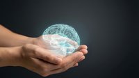 Human hands holding glowing digital brain with neural network connections on dark background for artificial intelligence and technology concepts.