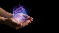 Male hands holding glowing purple brain with electric energy effects on black background for medical neuroscience and mental health concepts.