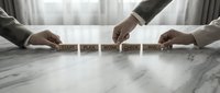 Business team arranging wooden blocks spelling START PLAN WORK CHECK WIN on marble desk representing strategic planning process and teamwork success methodology.