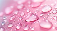 Water drops on pink surface creating natural abstract pattern with soft bokeh effect and light reflection, macro photography for cosmetic and wellness backgrounds.