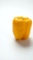 Fresh yellow bell pepper isolated on white background, ready for culinary, nutrition, and healthy eating design projects.