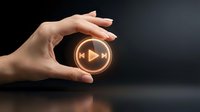 Hand holding glowing golden play button icon against dark background. Perfect for media, streaming, entertainment, and digital content concepts.