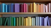 Colorful books arranged by spectrum colors on wooden shelves create rainbow pattern. Books spines in pastel and vibrant hues stand vertically in organized rows.