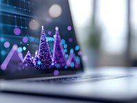 Glowing purple Christmas trees on laptop keyboard with bokeh lights and blurred background, modern holiday technology concept for business designs.