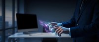 Businessman using holographic technology interface with glowing digital effects in modern office environment for futuristic business presentations.