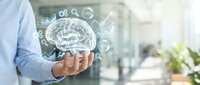 Businessman holding digital brain with AI icons and data analytics symbols for artificial intelligence and technology innovation.