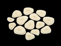 Dried white fig slices scattered naturally, isolated on transparent background, ready for food packaging, stickers, print on demand, T-shirt design, and clipart use.