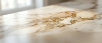 Luxurious marble surface with golden veining and natural stone patterns for elegant interior design and architectural applications.