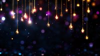 Glowing vintage light bulbs hanging on golden strings against dark starry background with colorful bokeh lights creating magical atmosphere for festive design.