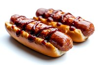 Grilled hot dogs in toasted buns topped with mustard and ketchup on white background, close-up view showing juicy sausages with classic condiments. Food photography.