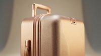 Rose gold hardshell suitcase with textured surface and metallic handle, luxury travel luggage on neutral background for travel and lifestyle concepts.