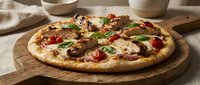 Freshly baked pizza with melted cheese, tomatoes, and green peppers on wooden serving board, ideal for food and restaurant marketing.