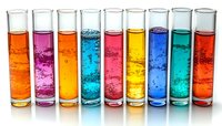 Row of tall glass test tubes filled with vibrant colored liquids showing bubbles and chemical reactions against white background, scientific laboratory concept.