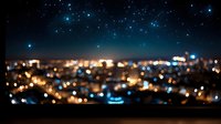 Blurred urban cityscape at night with glowing lights and bright stars in dark sky above creating magical atmospheric scene. Bokeh effect adds dreamy mood.