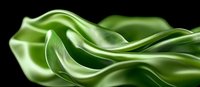 Luxurious green silk fabric with elegant folds and waves creates dramatic light and shadow effect on black background, suitable for fashion and luxury designs.
