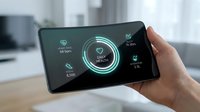 Heart health monitoring app displayed on smartphone screen held in hand, showing vital signs and wellness tracking data for medical technology and healthcare applications.