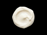 Creamy white cosmetic product swirl isolated on transparent background, ready for skincare packaging, beauty product design, print-on-demand, and sublimation applications.