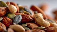 Mixed nuts and seeds collection with almonds cashews pumpkin seeds healthy snacking protein rich food ingredients for cooking and baking nutritious diet.