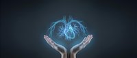 Hands protecting glowing blue lungs hologram on dark background for healthcare, medical technology and respiratory system awareness campaigns.