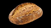 Rustic whole grain artisan bread loaf with golden crust, isolated on transparent background, ready for t-shirt design, stickers, clipart, and print on demand use.
