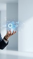 Businessman hand presenting holographic digital interface with gears, charts and data analytics symbols for technology and business automation solutions.