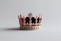 Royal crown with burgundy velvet and silver ornate details featuring crystal embellishments on white background, isolated luxury accessory for design projects.