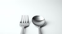 Modern stainless steel fork and spoon set isolated on white background for kitchen dining restaurant culinary design projects and food service branding.