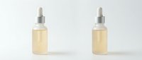 Two glass dropper bottles with pale yellow serum or oil isolated on white background, ready for cosmetic, skincare, and wellness product packaging design.