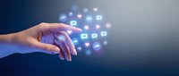 Hand reaching toward floating digital communication icons with glowing social media symbols for modern technology and connectivity concepts.