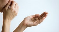 Male hands demonstrating prayer or meditation gesture against clean white background for wellness and spiritual content.